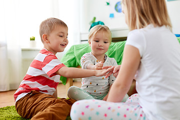 Image showing kids playing rock-paper-scissors game at home