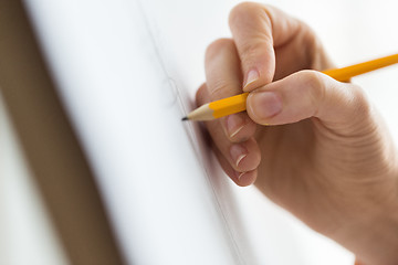 Image showing artist with pencil drawing picture at art studio