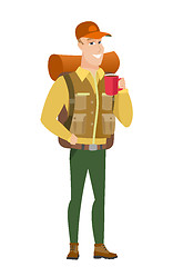 Image showing Caucasian traveler holding cup of coffee.