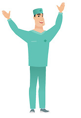 Image showing Surgeon standing with raised arms up.