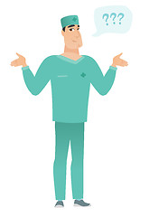 Image showing Caucasian confused doctor with spread arms.