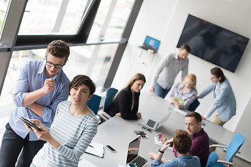 Image showing Two Business People Working With Tablet in office