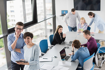 Image showing Two Business People Working With Tablet in office