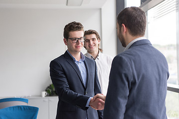 Image showing cloasing the deal in modern office interior