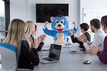 Image showing boss dresed as bear having fun with business people in trendy of