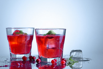 Image showing closeup of a cape cod cocktail or vodka cranberry on a blue background
