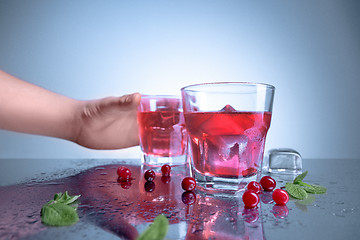 Image showing closeup of a cape cod cocktail or vodka cranberry on a blue background