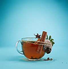 Image showing The herbal tea on a blue background