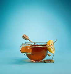 Image showing The herbal tea on a blue background