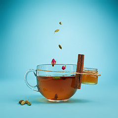 Image showing The herbal tea on a blue background