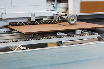 Image showing chipboards on conveyer at furniture factory