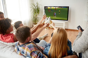 Image showing friends clinking beer and watching soccer game