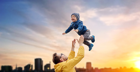 Image showing father with son playing and having fun outdoors