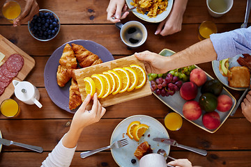 Image showing group of people having breakfast at table