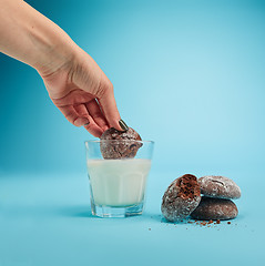 Image showing Glass of milk and oatmeal cookies. Morning dessert