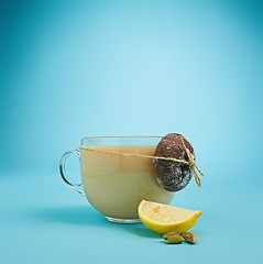 Image showing The herbal tea on a blue background