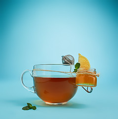 Image showing The herbal tea on a blue background