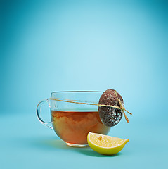 Image showing The herbal tea on a blue background