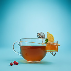 Image showing The herbal tea on a blue background