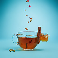 Image showing The herbal tea on a blue background