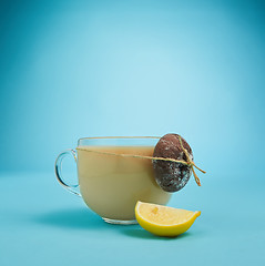 Image showing The herbal tea on a blue background