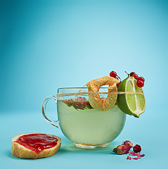 Image showing The herbal tea on a blue background