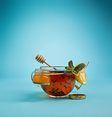 Image showing The herbal tea on a blue background