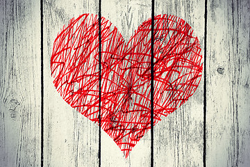 Image showing Abstract heart with messy pattern on vintage wooden wall