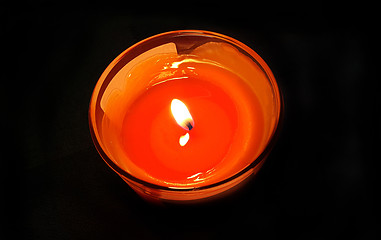 Image showing Burning candle in the dark