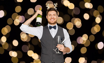 Image showing man with bottle of champagne at christmas party