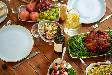 Image showing various food on served wooden table