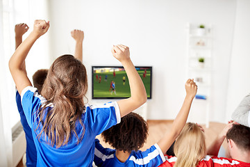 Image showing friends or soccer fans watching game on tv at home