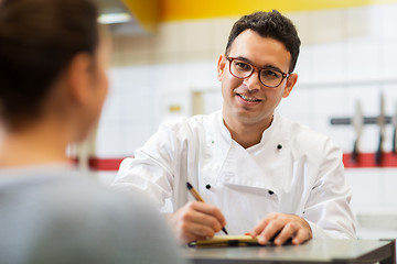 Image showing chef at fast food restaurant writing order