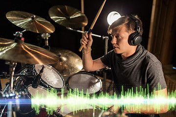 Image showing musician playing drums at sound recording studio