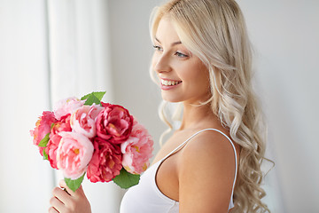 Image showing close up of woman with bunch of flowers