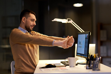 Image showing man with computer working late at night office