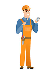 Image showing Caucasian builder holding a mobile phone.