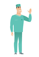 Image showing Young caucasian doctor waving his hand.