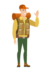 Image showing Young caucasian traveler waving his hand.