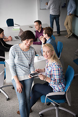Image showing Pretty Businesswomen Using Tablet In Office Building during conf