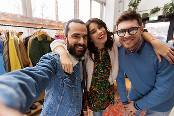 Image showing friends taking selfie at vintage clothing store