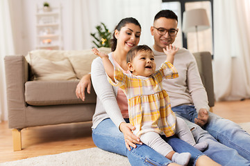 Image showing happy family and baby daughter playing at home