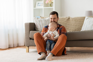 Image showing happy father with little baby boy at home