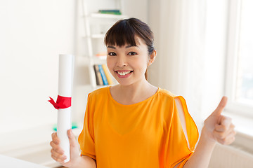 Image showing happy student girl with diploma showing thumbs up