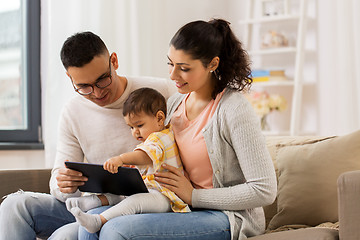 Image showing mother, father and baby with tablet pc at home