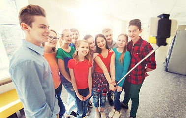 Image showing group of students taking selfie with smartphone