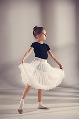Image showing The little balerina dancer on gray background