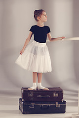 Image showing The little girl as balerina dancer standing at studio