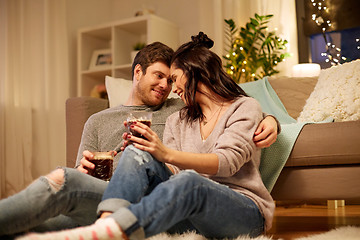 Image showing happy couple drinking coffee and eating at home