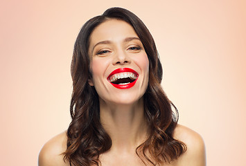 Image showing beautiful laughing young woman with red lipstick